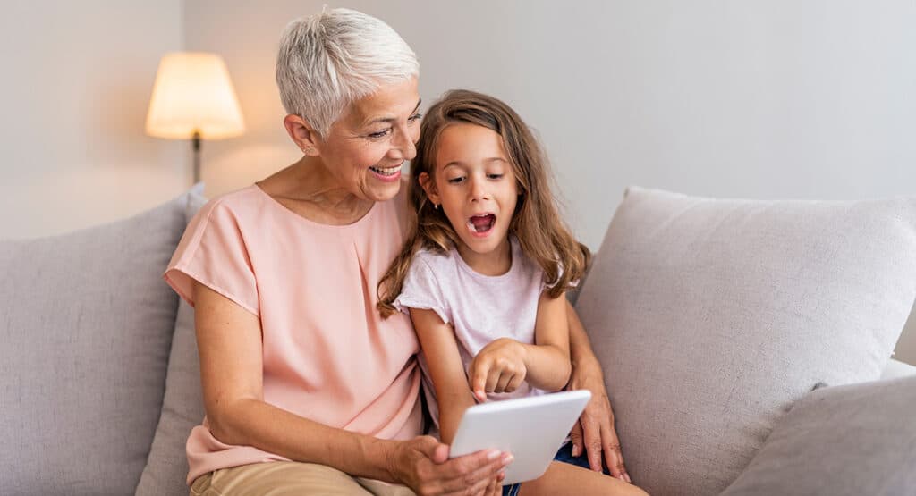 Grandma and child using tablet