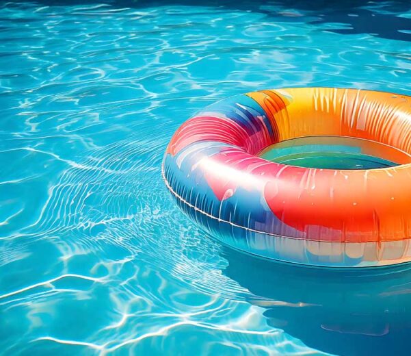 Colorful tube floating on pool surface