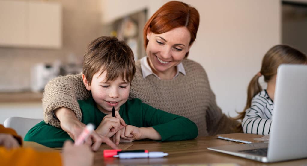 Homeschool teacher with students.