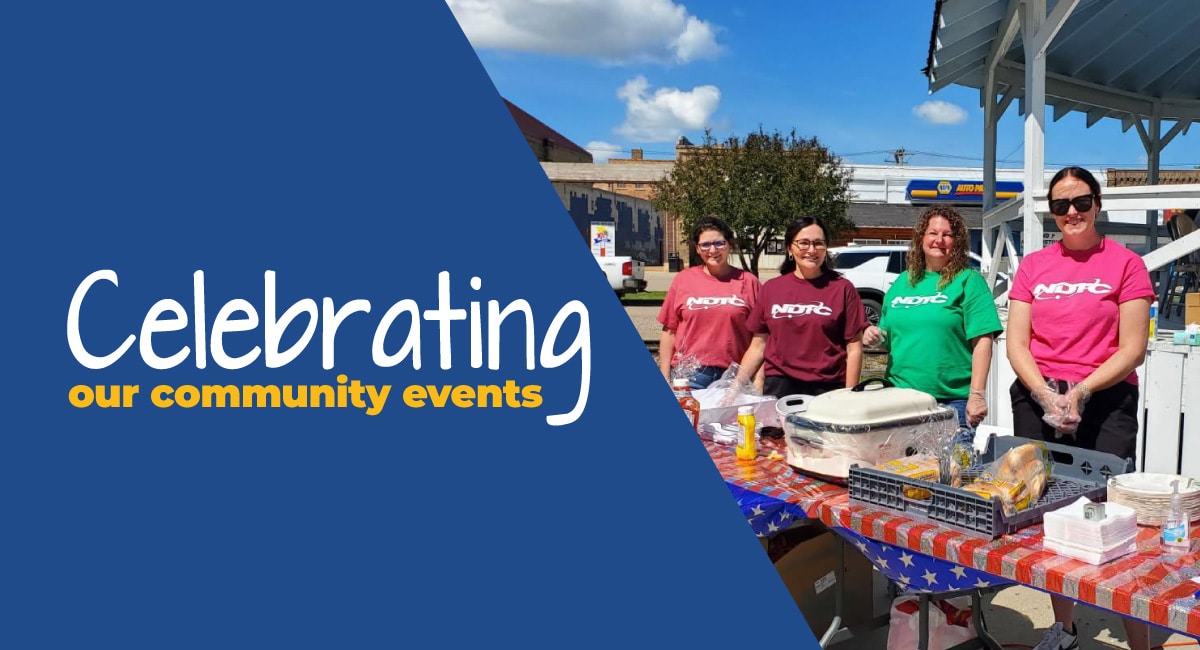Celebrating our community events. NDTC employees at a community picnic event.